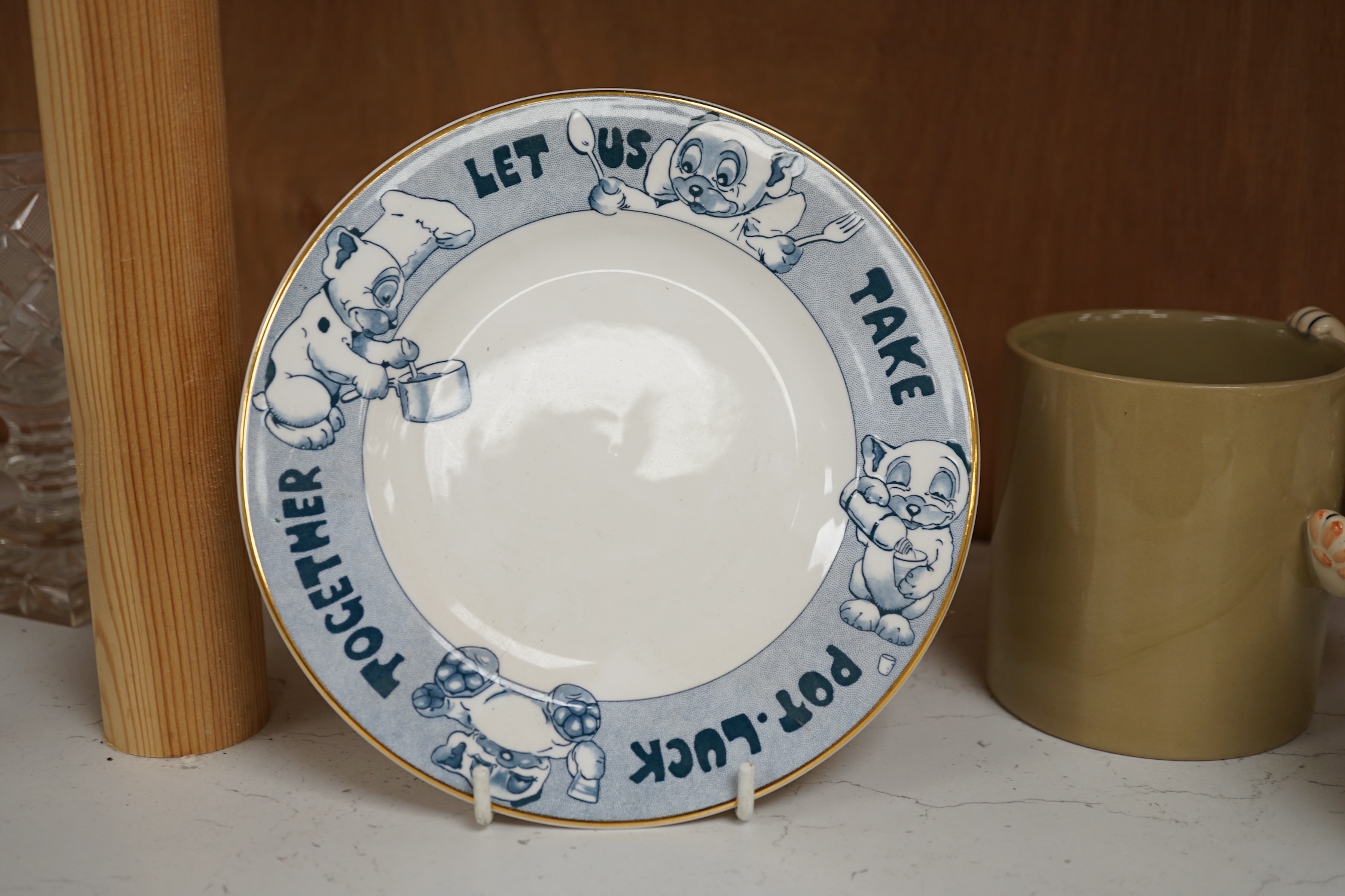 A Richard Dennis Bonzo Dog mug and matching plate and a Dennis China glazed pottery mug, plate 17cm diameter (3). Condition - slight chip to base edge of plate